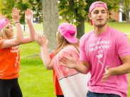 Welcome Week leaders start a cheer with new students on Move-In Day 2017.