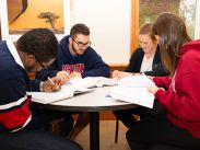 Students gather in the study and self-serve cafe area of Patterson Hall.