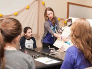 Science students volunteer at the Girls Get WISE event to encourage young girls to pursue education and careers in STEM.