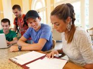 Students reviewing notes in the K.C. Irving Environmental Science Centre’s Garden Room.